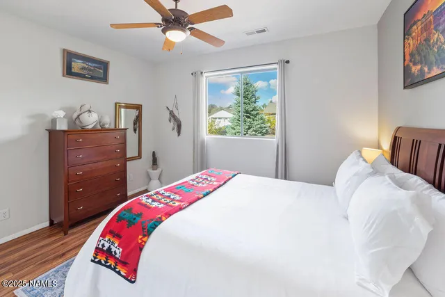 a bedroom with a bed and a dresser