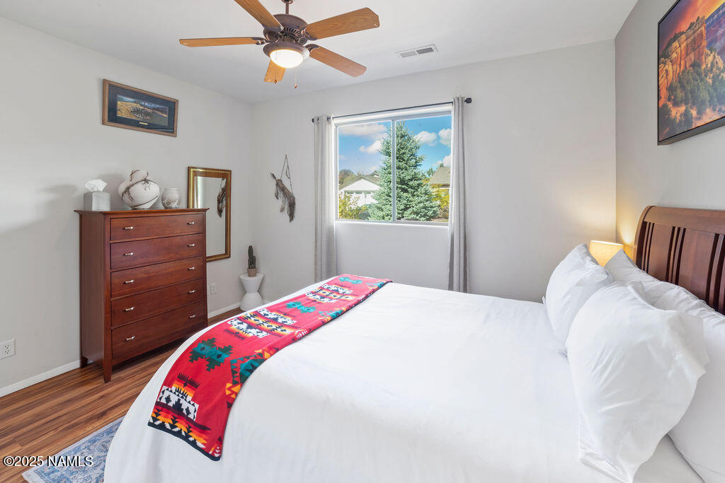 603 Brookline Loop Williams, AZ 86046 - Photo 36 of 57 a bedroom with a bed and a dresser