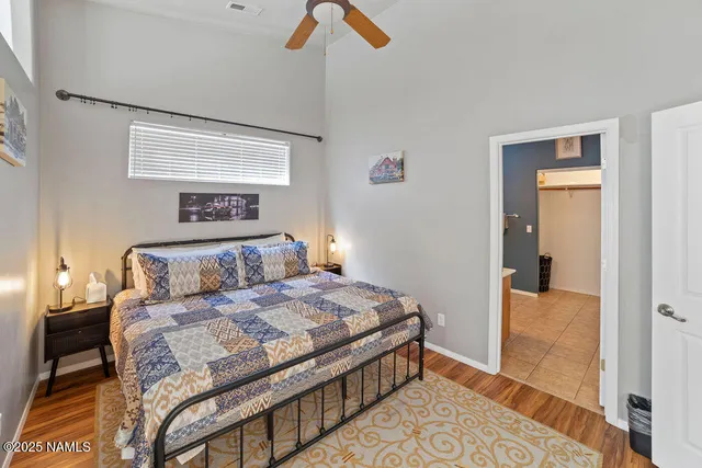 a bathroom with a granite countertop sink mirror vanity and a toilet