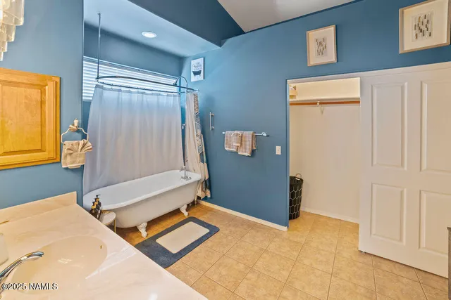 a bathroom with a tub and shower