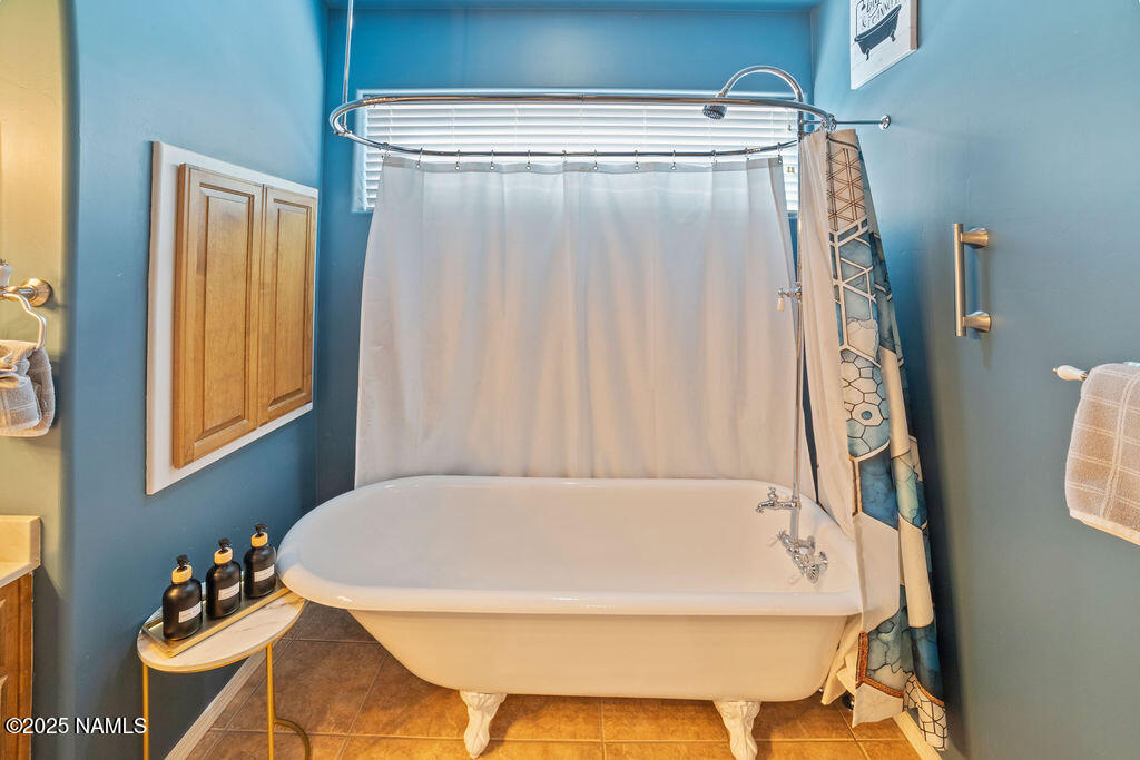 603 Brookline Loop Williams, AZ 86046 - Photo 44 of 57 a bathroom with a tub and shower