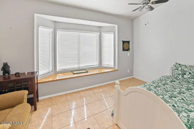 a view of a house with backyard sitting area and garden