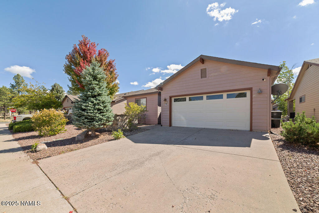 603 Brookline Loop Williams, AZ 86046 - Photo 5 of 57 a front view of a house with a yard and garage