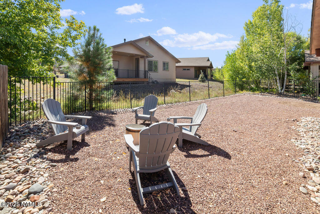 603 Brookline Loop Williams, AZ 86046 - Photo 53 of 57 a view of backyard with outdoor seating and trees