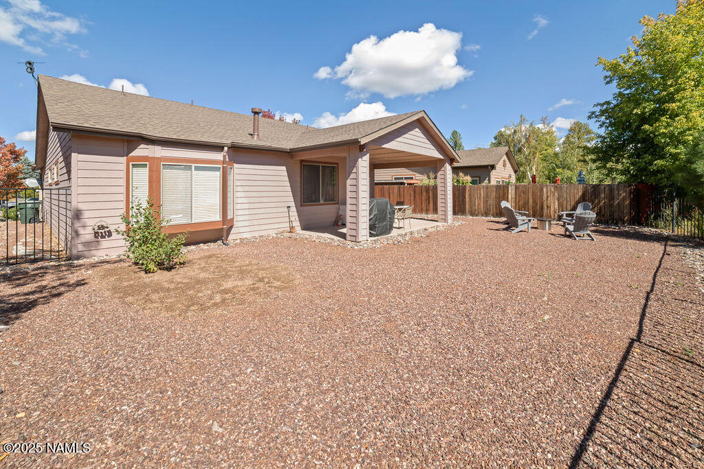 603 Brookline Loop Williams, AZ 86046 - Photo 54 of 57 a view of a house with a yard and potted plants