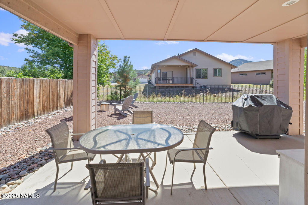 603 Brookline Loop Williams, AZ 86046 - Photo 57 of 57 a dinning table and chairs in patio of the house