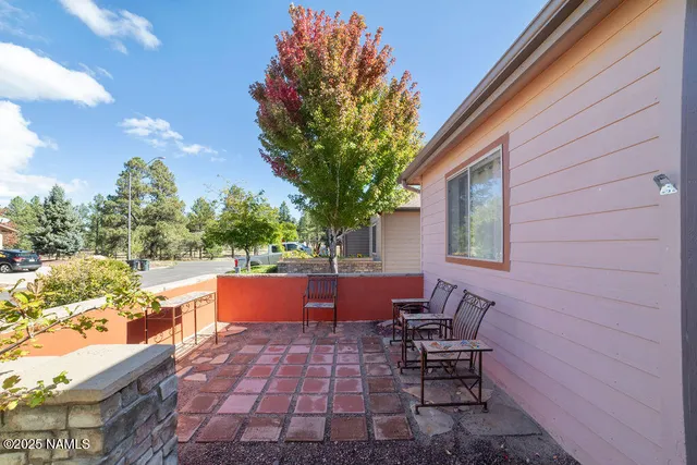 a room with a table and a chandelier