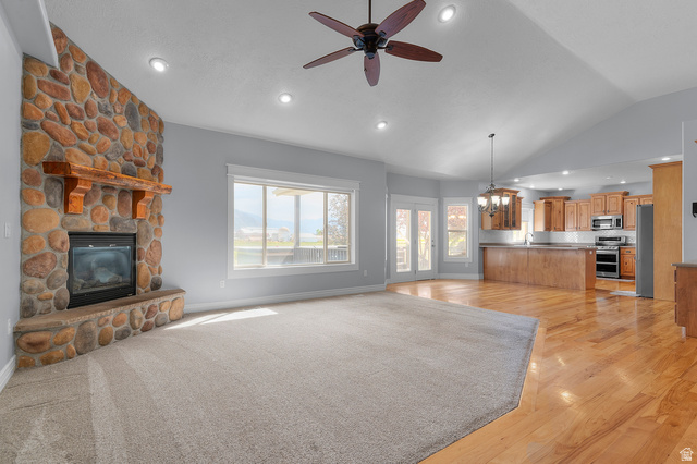 1501 West Elk Circle Mapleton, UT 84664 - Photo 14 of 39 Great room with a stone-clad fireplace and wood mantle