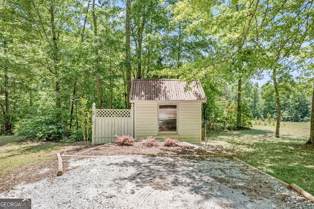 230 Haynes Road Moreland, GA 30259 - Photo 30 of 38 a front view of a house with a yard