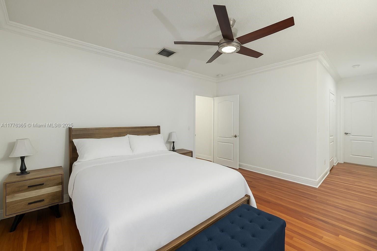 411 Southwest 22nd Road Miami, FL 33129 - Photo 15 of 25 a bed room with a bed and a ceiling fan