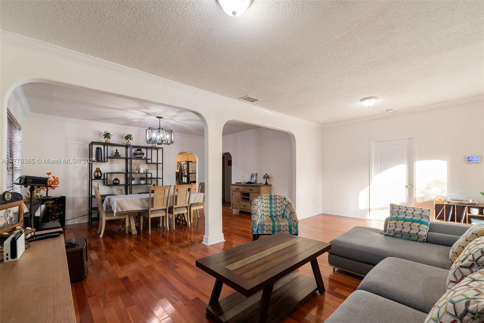 411 Southwest 22nd Road Miami, FL 33129 - Photo 7 of 25 a living room with furniture and wooden floor