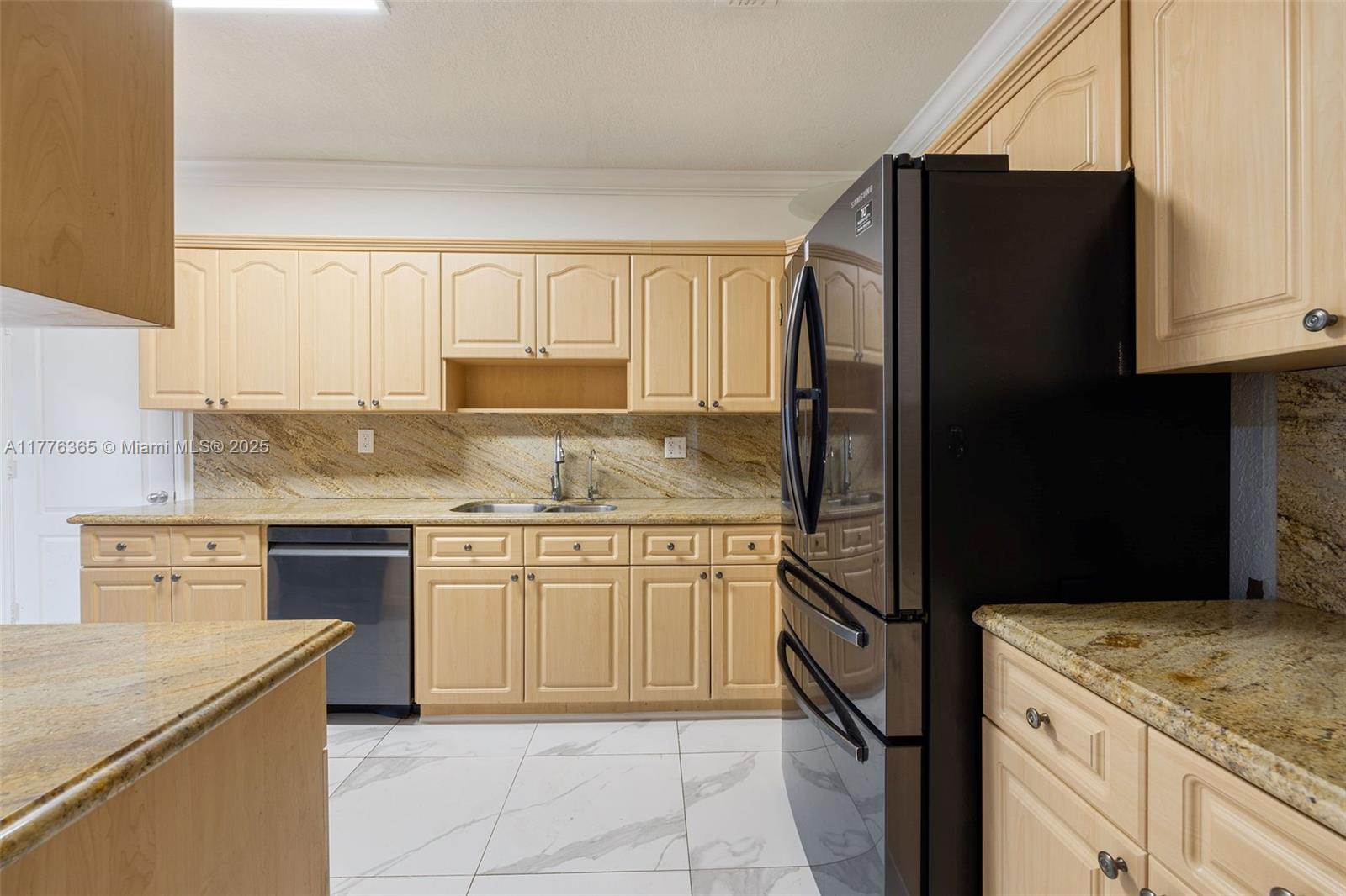 411 Southwest 22nd Road Miami, FL 33129 - Photo 9 of 25 a kitchen with granite countertop cabinets and steel stainless steel appliances