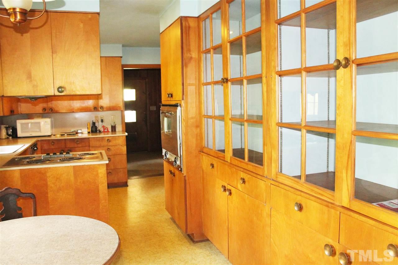 2624 Winton Road Durham, NC 27707 - Photo 12 of 25 Nice light-filled spot for casual meals. Tons of storage in the wall of custom retro cabinets.
