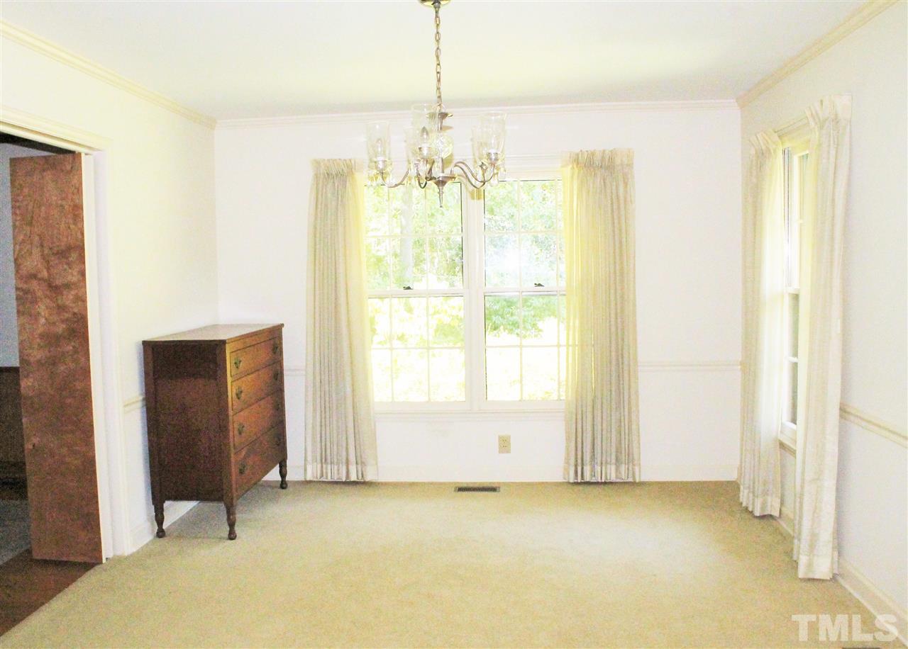 2624 Winton Road Durham, NC 27707 - Photo 6 of 25 The Dining Room has a classic chandelier that conveys with the home.