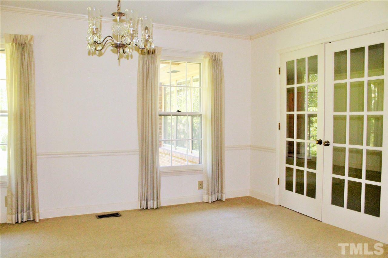 2624 Winton Road Durham, NC 27707 - Photo 7 of 25 The large formal Dining Room can handle a large table for gathering around. The French doors give an open feel even when they are closed for more private meals.