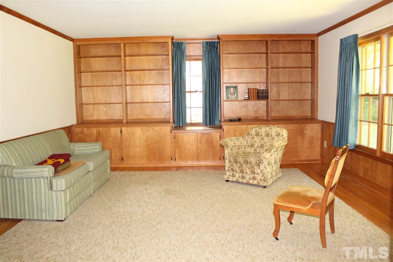 2624 Winton Road Durham, NC 27707 - Photo 8 of 25 The generous-sized Family Room includes custom built-in shelves for your books or collectibles and cabinetry to keep things tidy.