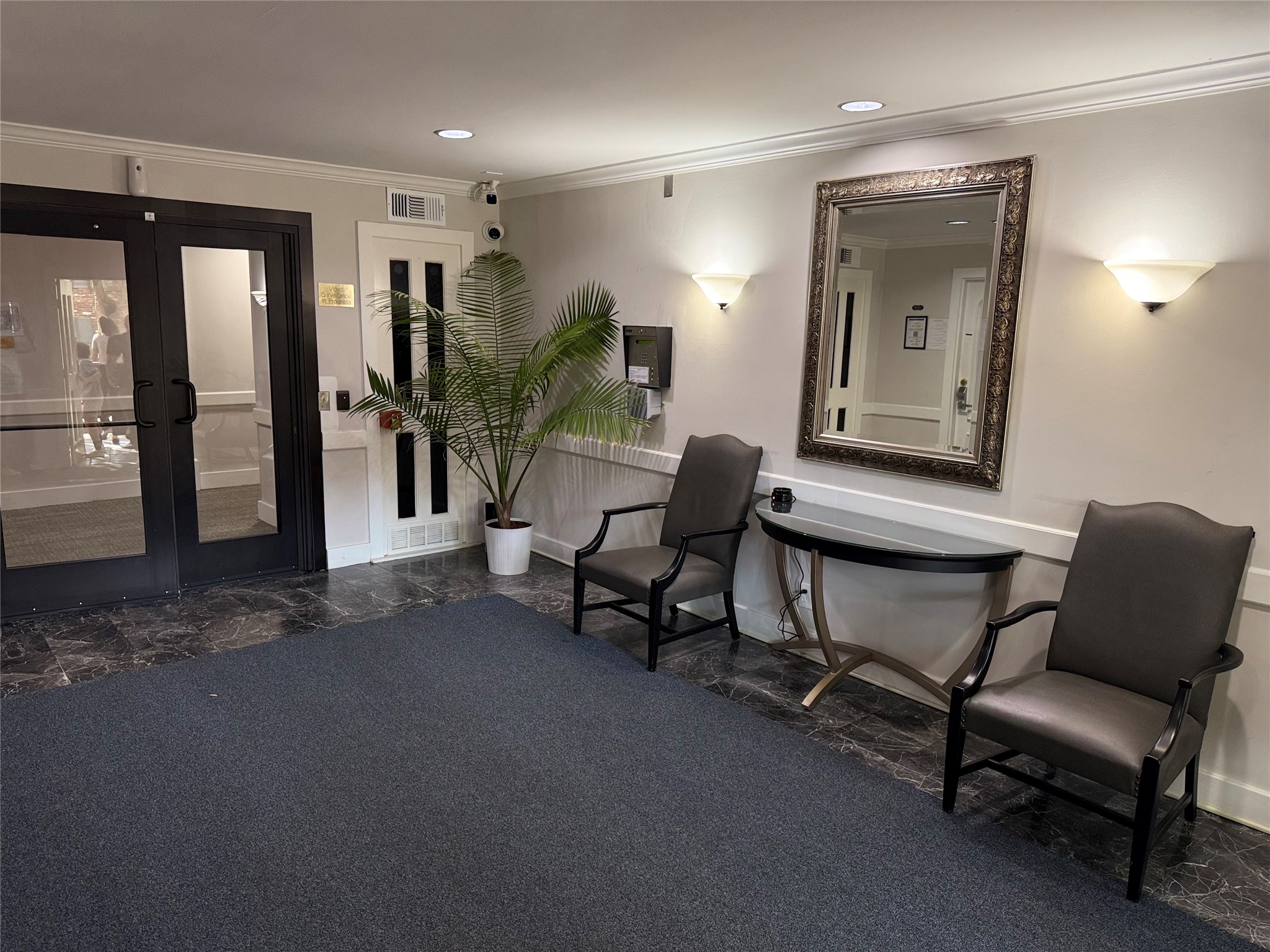 357 North Post Oak Lane, Unit 207 Houston, TX 77024 - Photo 11 of 25 a work room with furniture and potted plants
