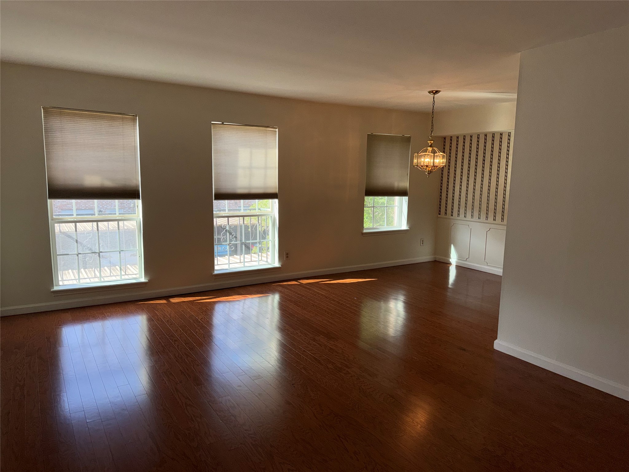 357 North Post Oak Lane, Unit 207 Houston, TX 77024 - Photo 17 of 25 a view of empty room with wooden floor and fan