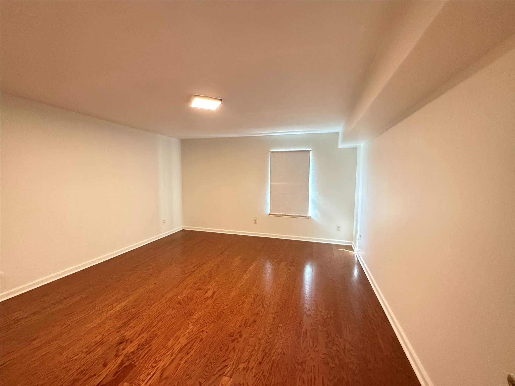 357 North Post Oak Lane, Unit 207 Houston, TX 77024 - Photo 21 of 25 a view of an empty room and wooden floor
