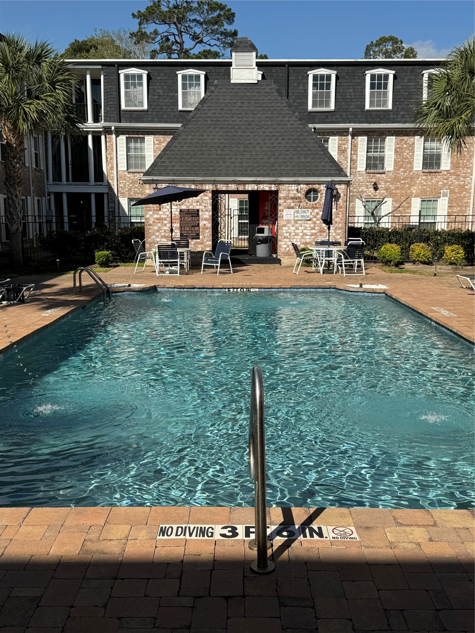 357 North Post Oak Lane, Unit 207 Houston, TX 77024 - Photo 3 of 25 a front view of a house with garden