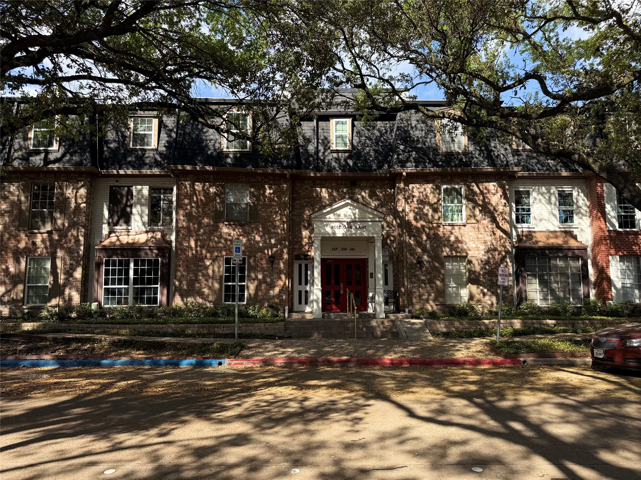 357 North Post Oak Lane, Unit 207 Houston, TX 77024 - Photo 8 of 25 a front view of a house with a street