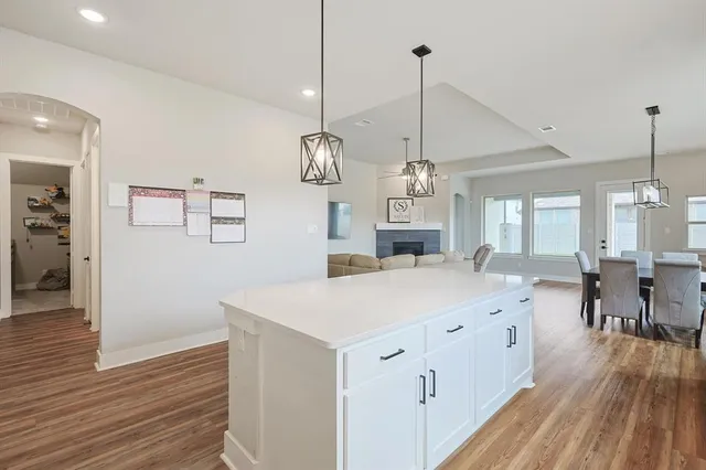 a large kitchen with a stove and a sink