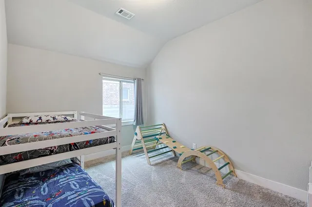 a bathroom with a granite countertop toilet sink and a mirror