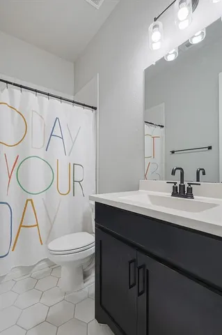 a room with a table and paintings on the wall