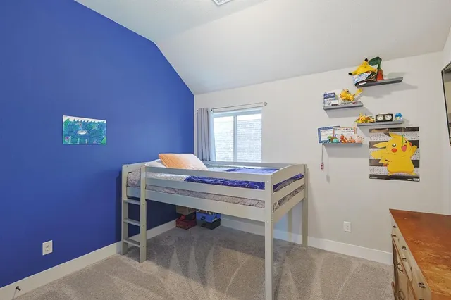 a bathroom with a sink a toilet a mirror and shower curtain