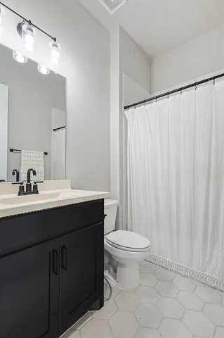 a bed room with a bed and a tv