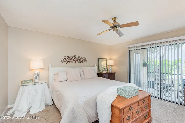 a bed room with a bed and a window