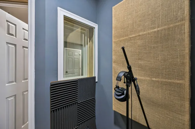 a bathroom with a sink a toilet and mirror