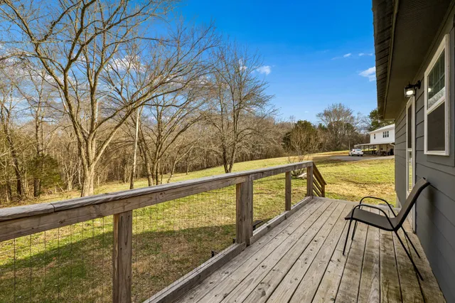 a view of balcony with furniture