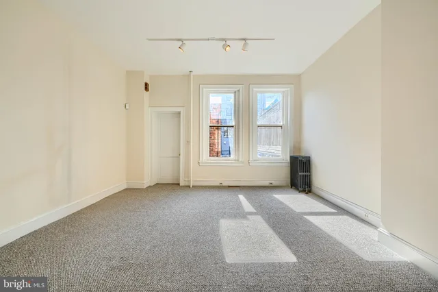 a view of an empty room with stairs