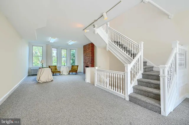 a view of a hallway with staircase