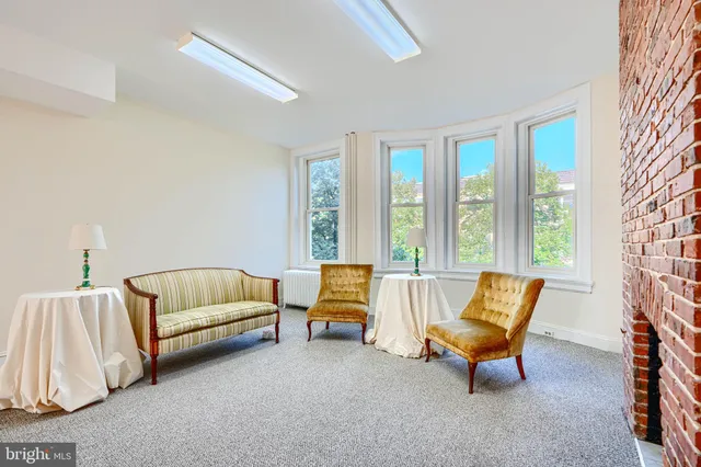 a view of livingroom with furniture and fireplace