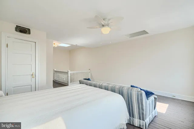 a kitchen with a sink a refrigerator and cabinets