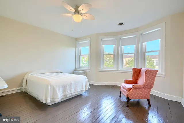 a white toilet sitting next to a bathroom sink