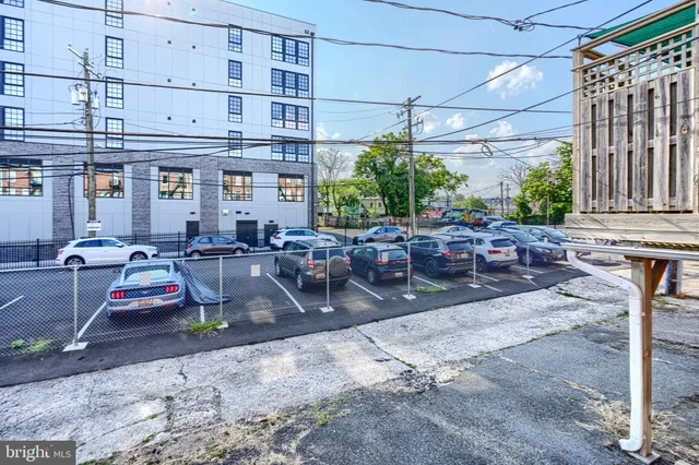 a view of a road with a building in the background