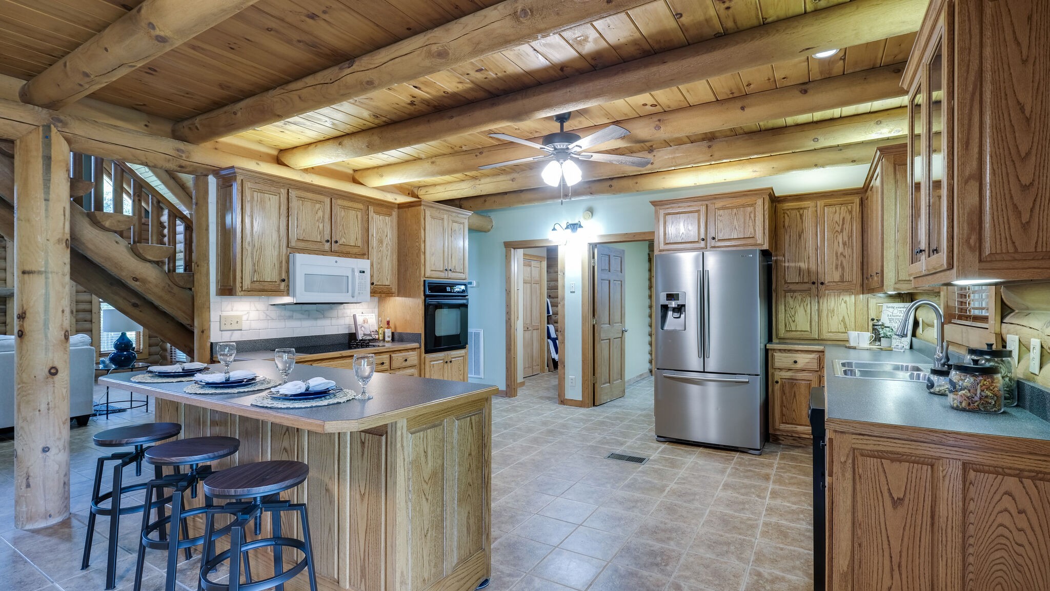 618 Greenvale Road Lebanon, TN 37090 - Photo 11 of 48 a kitchen with stainless steel appliances granite countertop a refrigerator a stove a sink a dining table and chairs with wooden floor