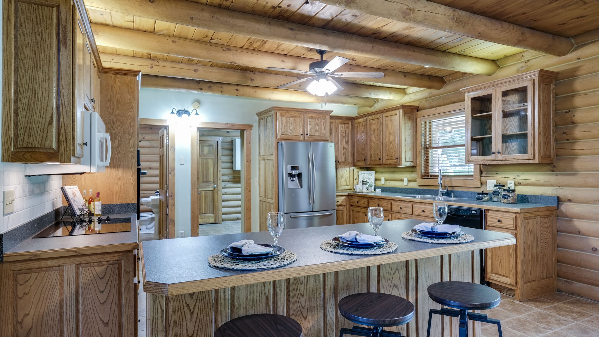 618 Greenvale Road Lebanon, TN 37090 - Photo 12 of 48 a kitchen with stainless steel appliances kitchen island granite countertop a table chairs and a refrigerator