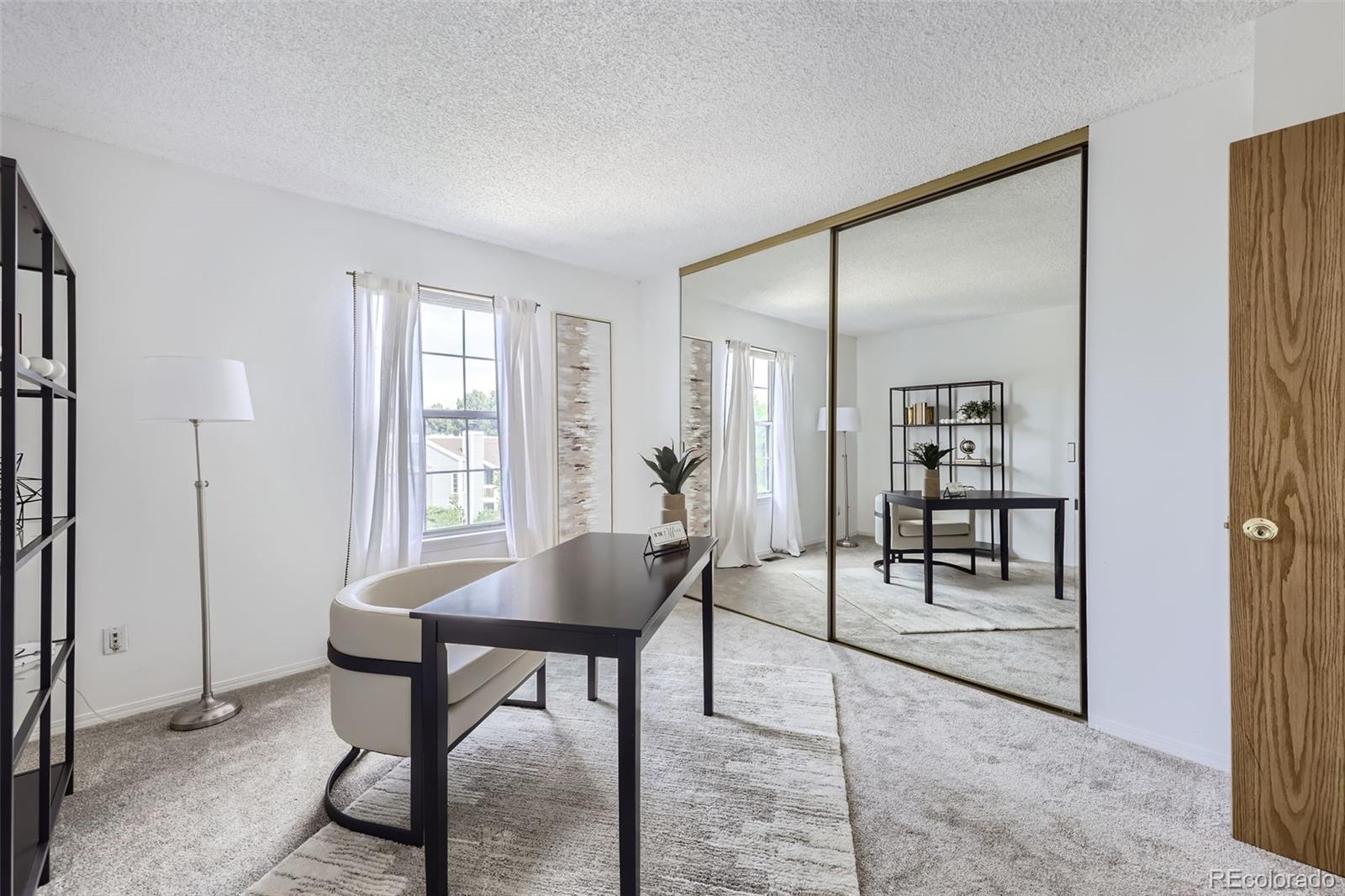 1811 South Quebec Way, Unit 244 Denver, CO 80231 - Photo 20 of 25 a workspace with furniture and window