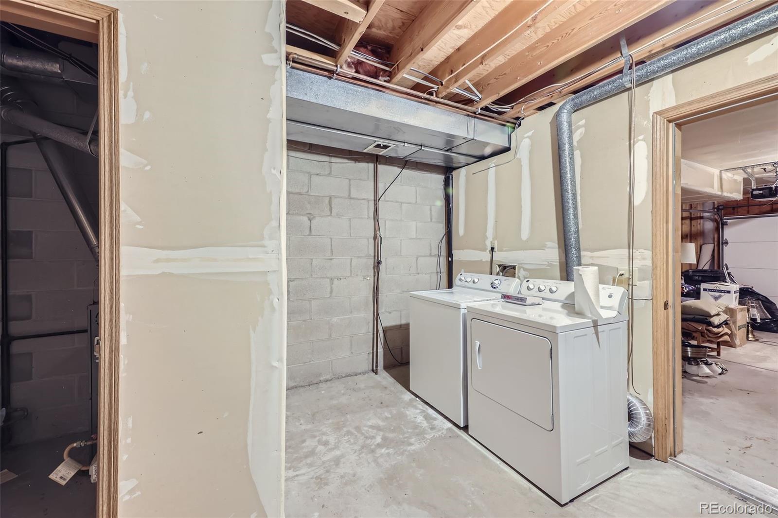 1811 South Quebec Way, Unit 244 Denver, CO 80231 - Photo 21 of 25 a utility room with dryer and washer