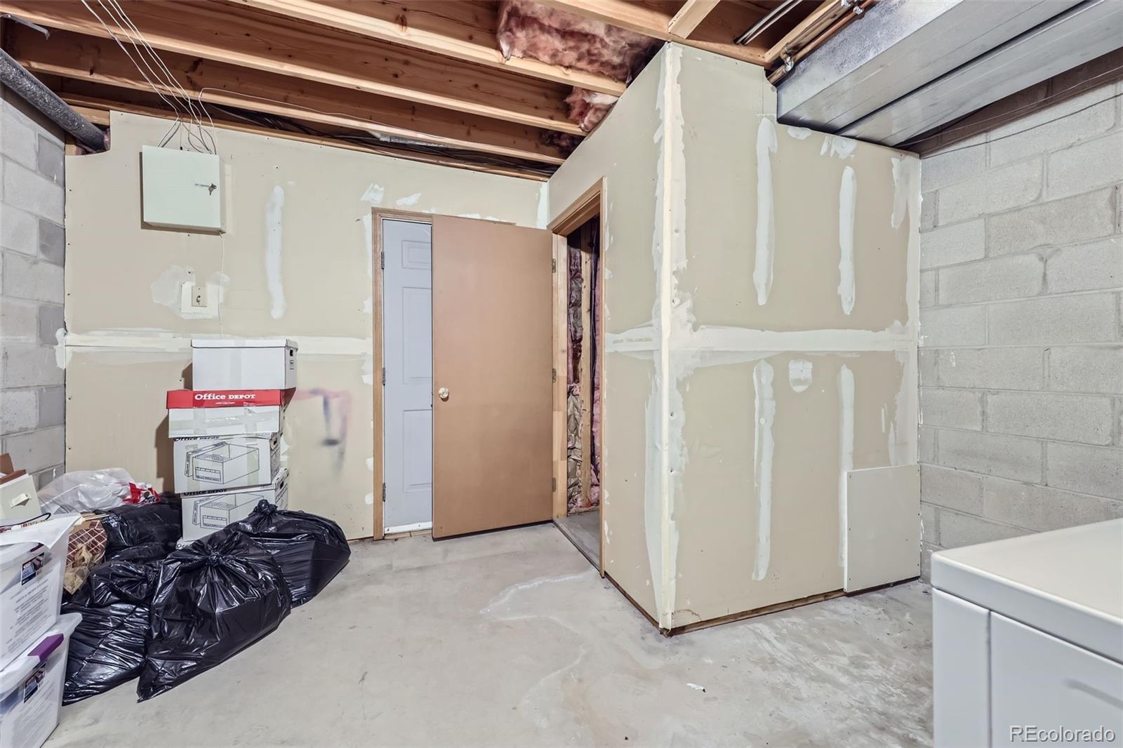 1811 South Quebec Way, Unit 244 Denver, CO 80231 - Photo 22 of 25 a view of bedroom with a bed and toys