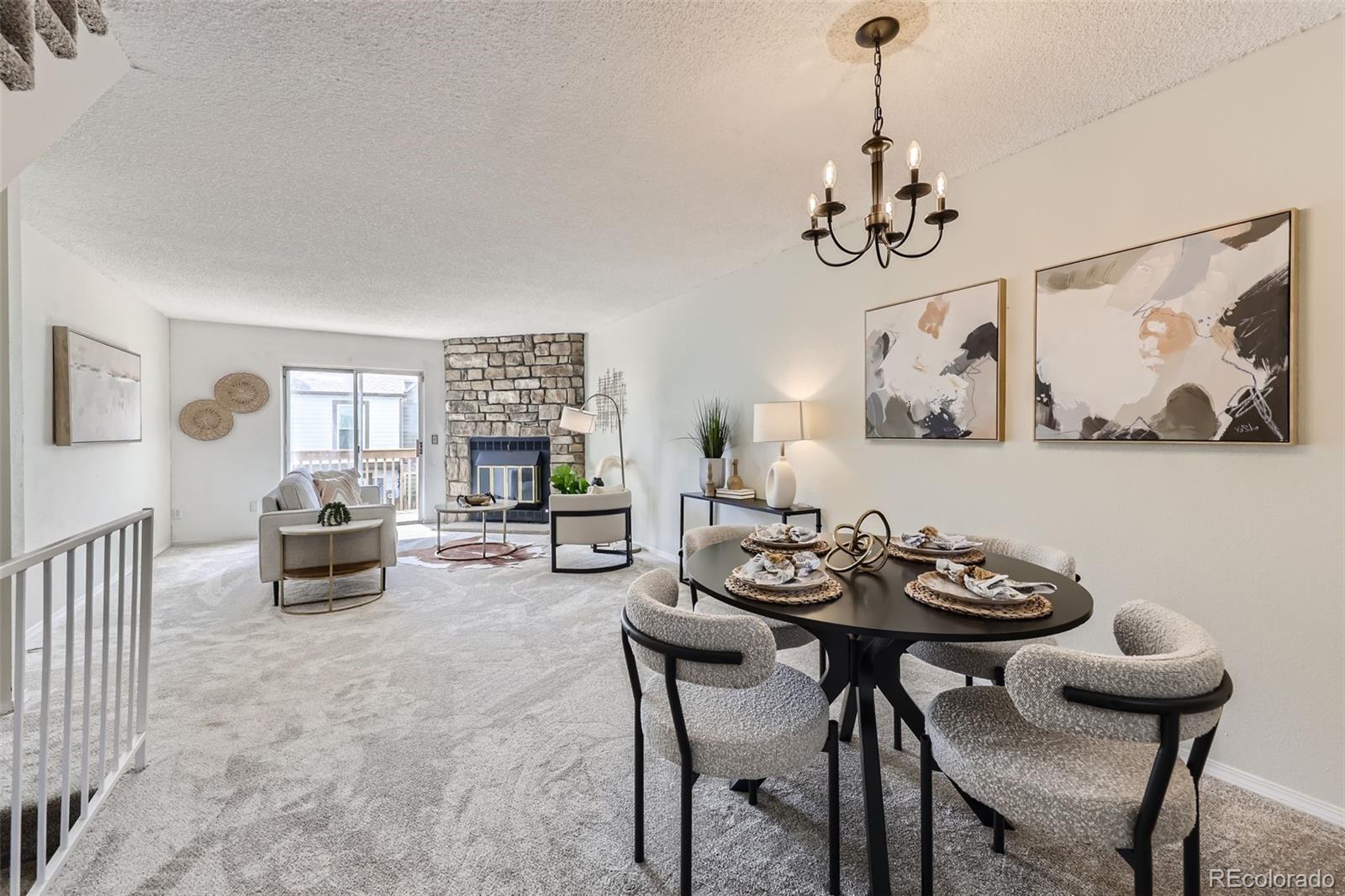 1811 South Quebec Way, Unit 244 Denver, CO 80231 - Photo 9 of 25 a view of a dining room with furniture wooden floor and a chandelier