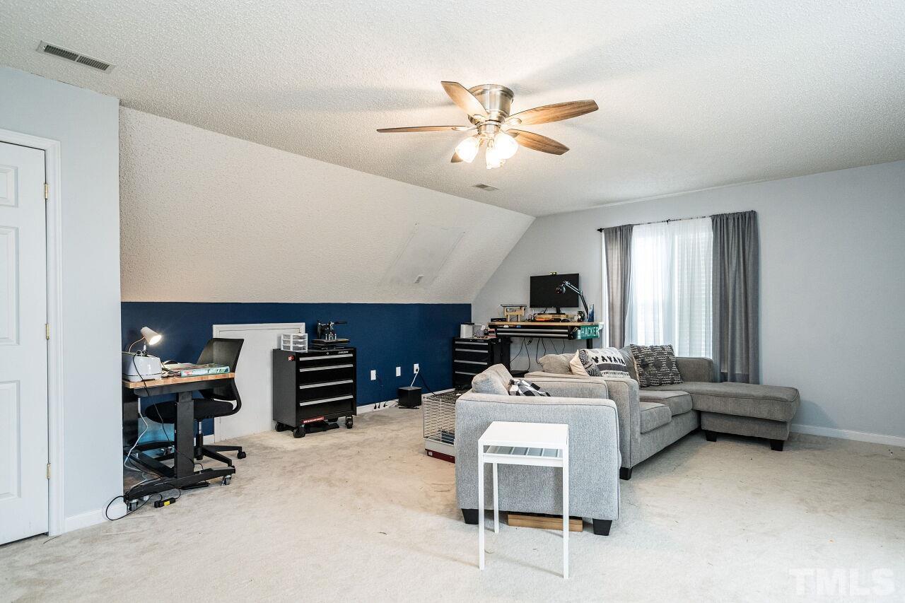 1037 Red Brick Road Garner, NC 27529 - Photo 23 of 33 a bedroom with furniture and a window