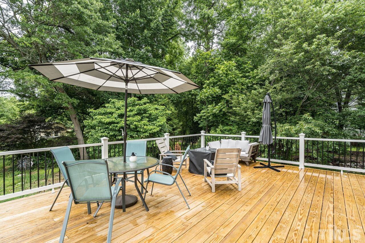 1037 Red Brick Road Garner, NC 27529 - Photo 24 of 33 a view of a chairs and table on the wooden floor