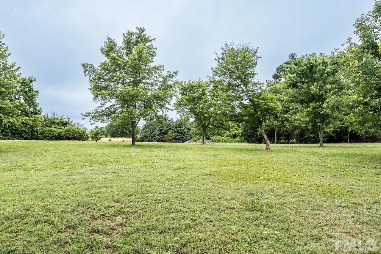 1037 Red Brick Road Garner, NC 27529 - Photo 28 of 33 a view of a field with trees