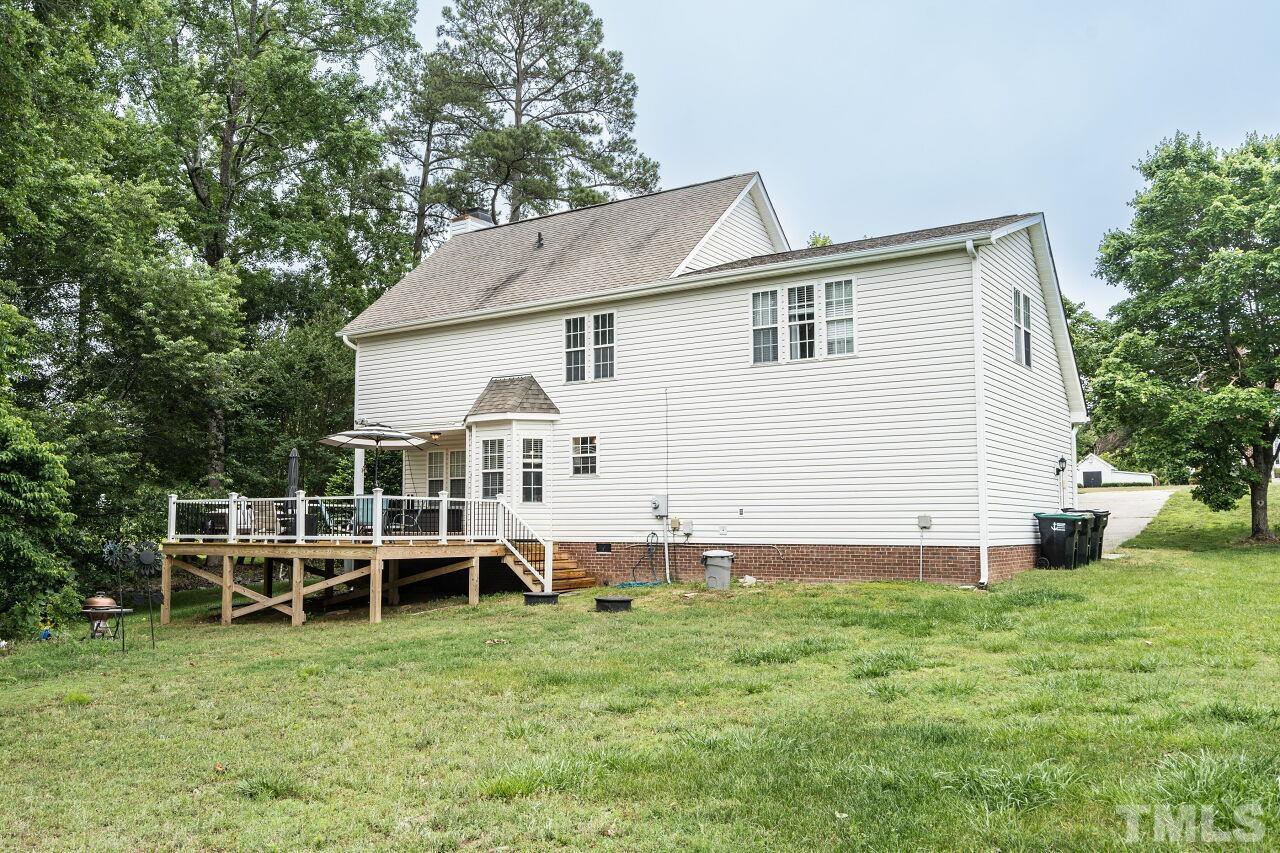 1037 Red Brick Road Garner, NC 27529 - Photo 29 of 33 a view of a house with a yard and sitting area