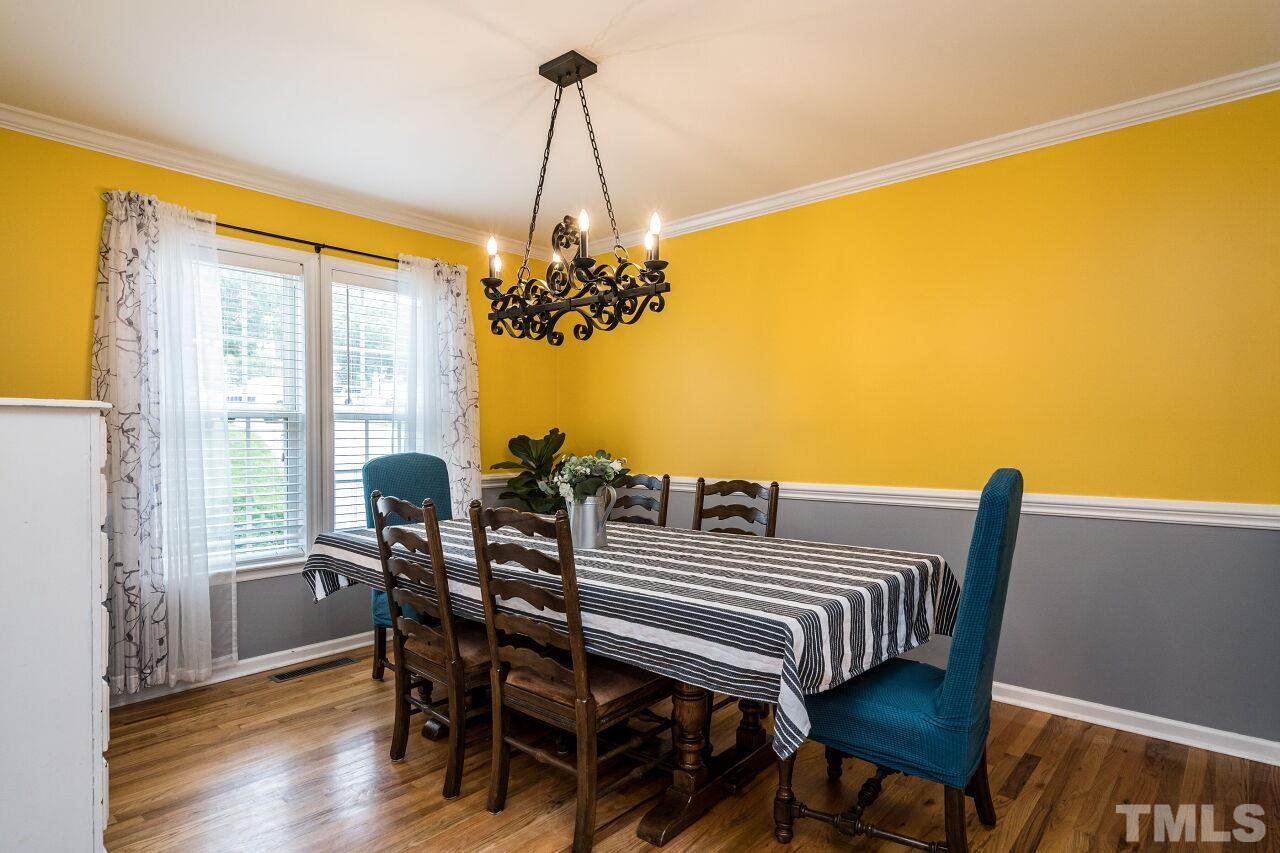 1037 Red Brick Road Garner, NC 27529 - Photo 4 of 33 a view of a dining room with furniture and window